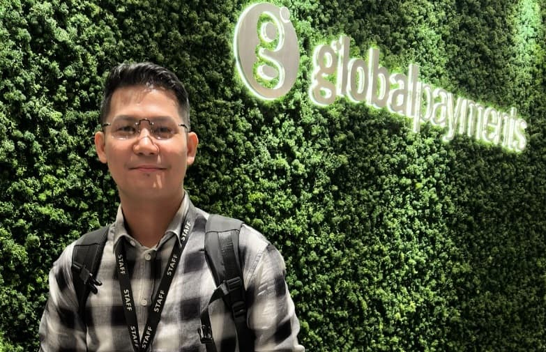 Mark in front of Global Payments background