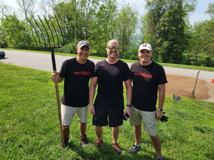 3 men smiling for photo