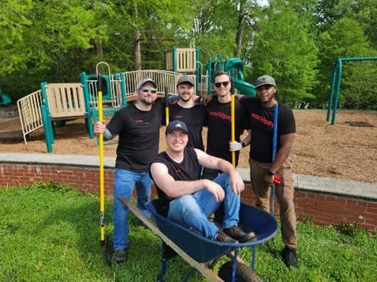 5 colleagues posing for photo