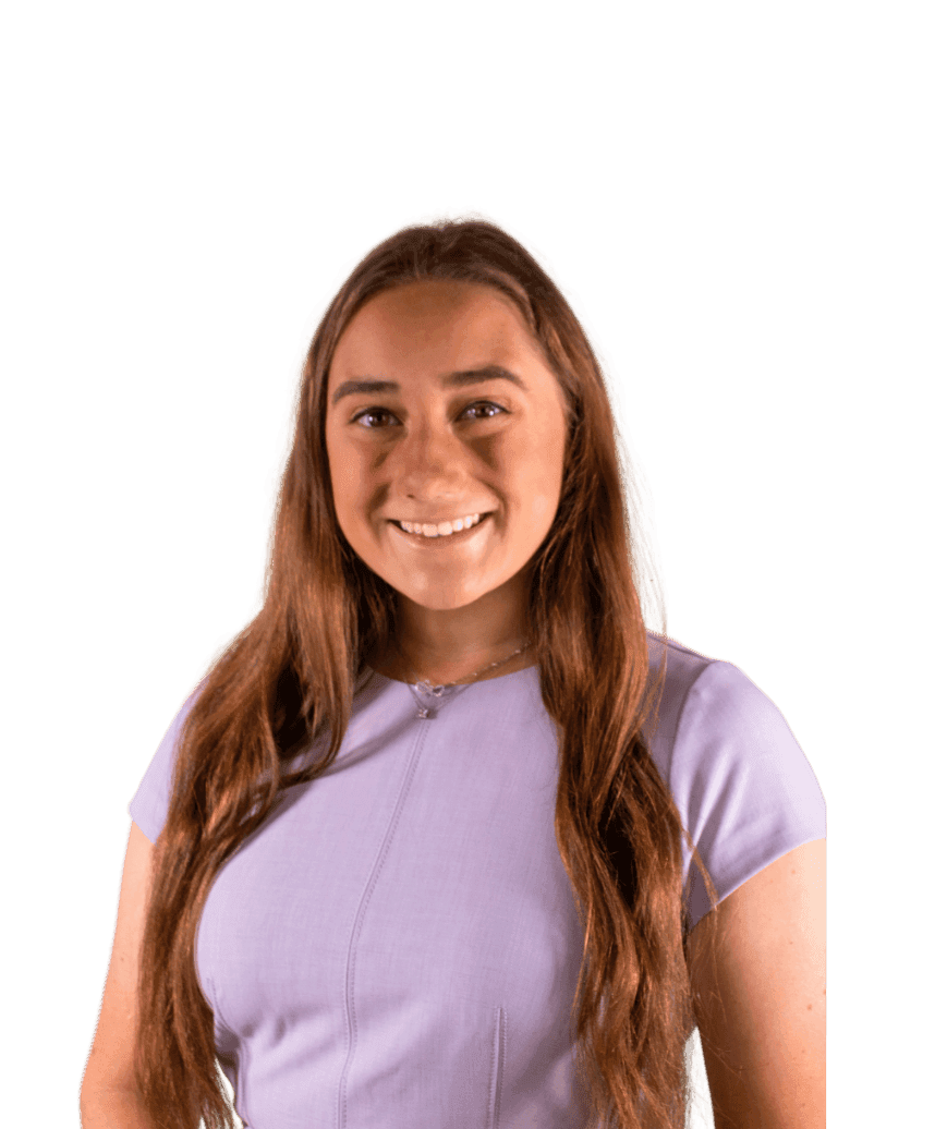 Smiling girl in purple top with long brown hair
